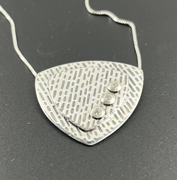 Textured sterling pendant with cz