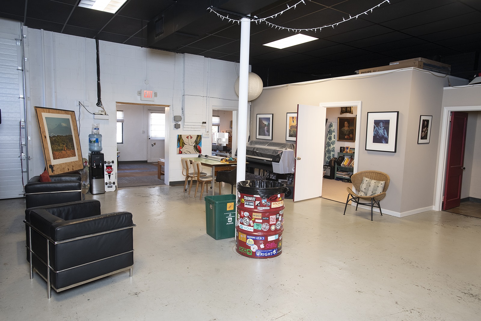 Bright artist studio with sketch easel and shelves