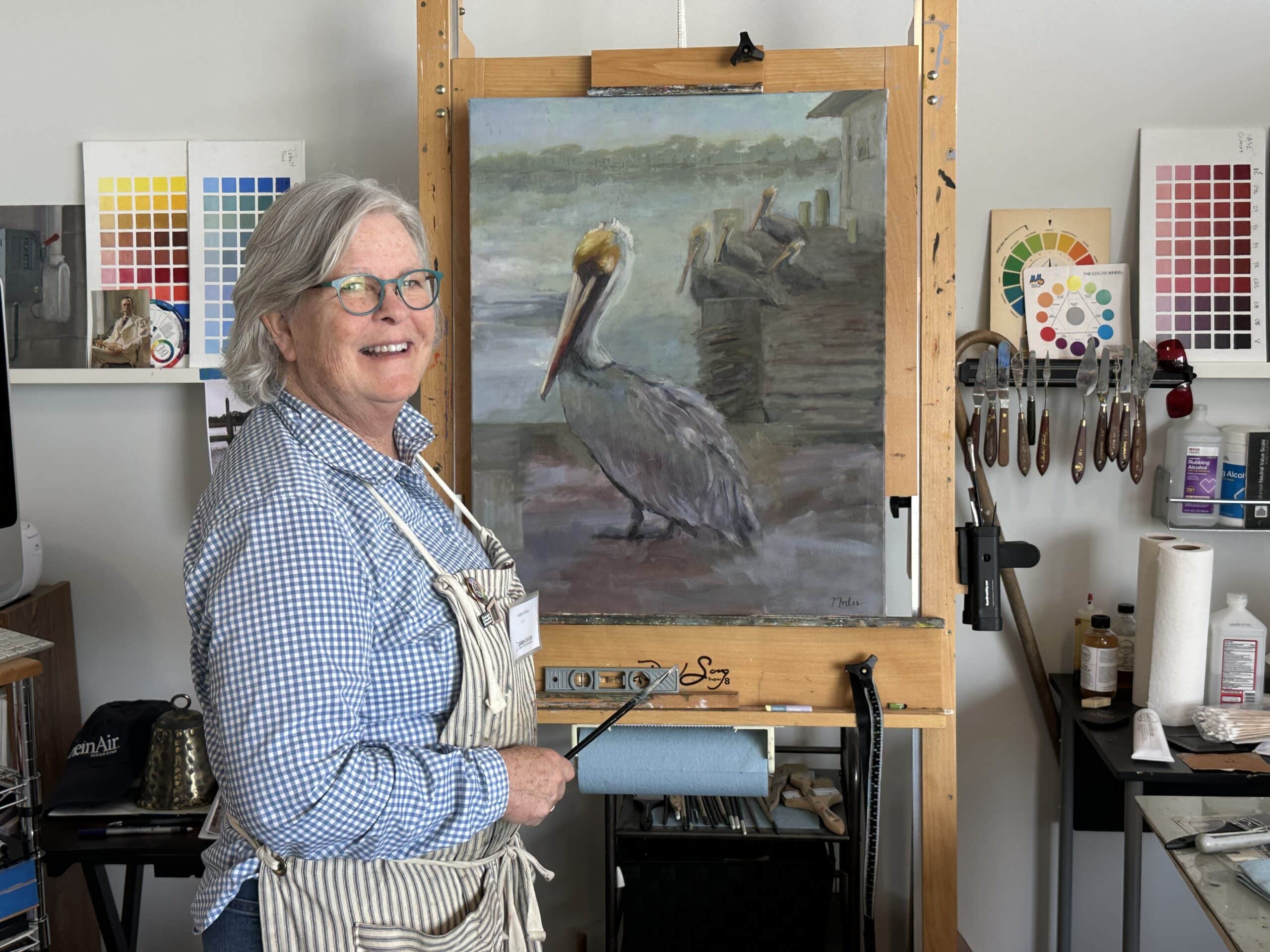Bright artist studio with sketch easel and shelves
